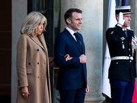 French President Emmanuel Macron and First Lady Brigitte receive Nigeria's President Bola Tinubo, who visits France for two days with the Fi...