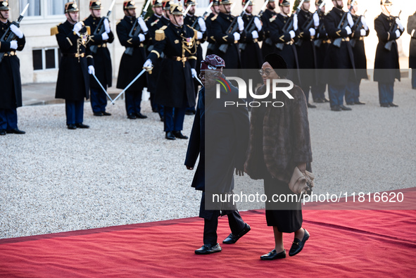 French President Emmanuel Macron and First Lady Brigitte receive Nigeria's President Bola Tinubo, who visits France for two days with the Fi...