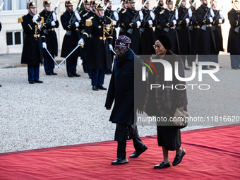 French President Emmanuel Macron and First Lady Brigitte receive Nigeria's President Bola Tinubo, who visits France for two days with the Fi...