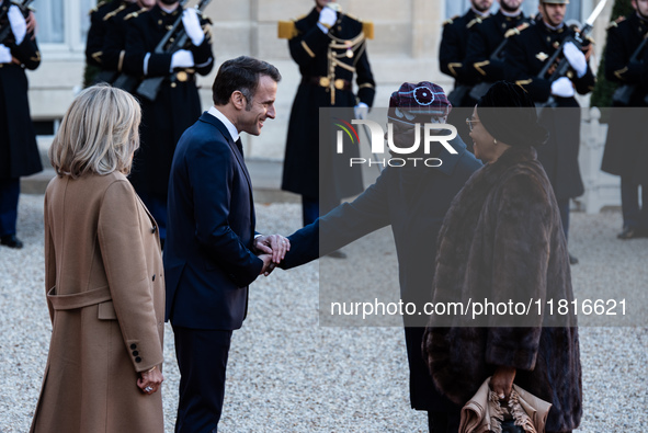 French President Emmanuel Macron and First Lady Brigitte receive Nigeria's President Bola Tinubo, who visits France for two days with the Fi...