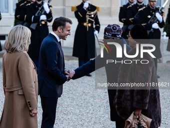 French President Emmanuel Macron and First Lady Brigitte receive Nigeria's President Bola Tinubo, who visits France for two days with the Fi...