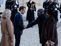 French President Emmanuel Macron and First Lady Brigitte receive Nigeria's President Bola Tinubo, who visits France for two days with the Fi...