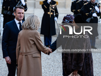 French President Emmanuel Macron and First Lady Brigitte receive Nigeria's President Bola Tinubo, who visits France for two days with the Fi...