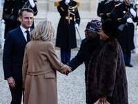 French President Emmanuel Macron and First Lady Brigitte receive Nigeria's President Bola Tinubo, who visits France for two days with the Fi...