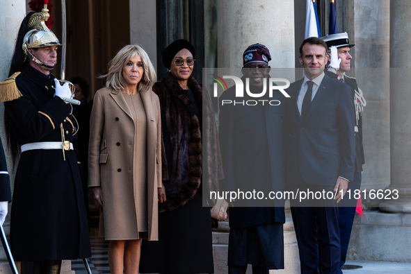 French President Emmanuel Macron and First Lady Brigitte receive Nigeria's President Bola Tinubo, who visits France for two days with the Fi...