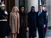 French President Emmanuel Macron and First Lady Brigitte receive Nigeria's President Bola Tinubo, who visits France for two days with the Fi...