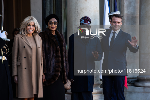 French President Emmanuel Macron and First Lady Brigitte receive Nigeria's President Bola Tinubo, who visits France for two days with the Fi...