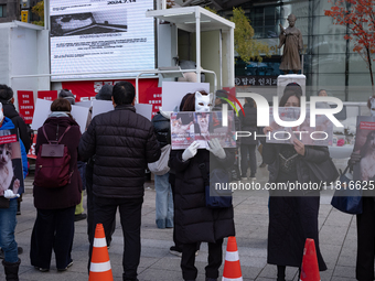 Members of the animal rights group CARE gather near the Chinese Embassy in Myeong-dong to call for the enactment of animal protection laws i...