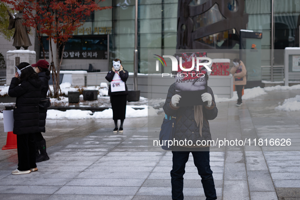 Members of the animal rights group CARE gather near the Chinese Embassy in Myeong-dong to call for the enactment of animal protection laws i...