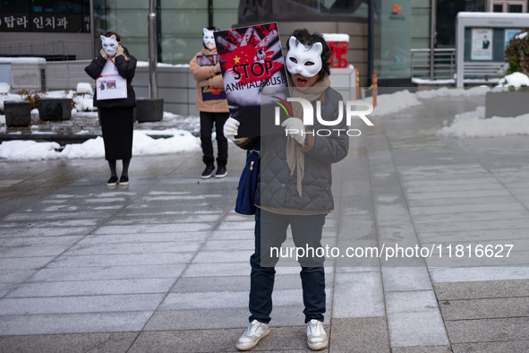 Members of the animal rights group CARE gather near the Chinese Embassy in Myeong-dong to call for the enactment of animal protection laws i...