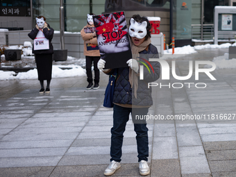 Members of the animal rights group CARE gather near the Chinese Embassy in Myeong-dong to call for the enactment of animal protection laws i...