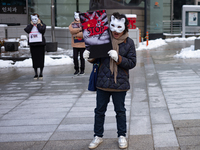 Members of the animal rights group CARE gather near the Chinese Embassy in Myeong-dong to call for the enactment of animal protection laws i...