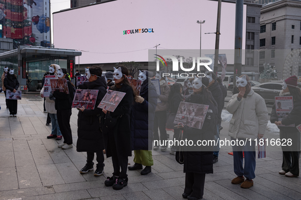 Members of the animal rights group CARE gather near the Chinese Embassy in Myeong-dong to call for the enactment of animal protection laws i...