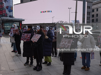 Members of the animal rights group CARE gather near the Chinese Embassy in Myeong-dong to call for the enactment of animal protection laws i...