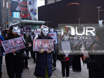 Members of the animal rights group CARE gather near the Chinese Embassy in Myeong-dong to call for the enactment of animal protection laws i...