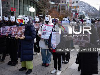 Members of the animal rights group CARE gather near the Chinese Embassy in Myeong-dong to call for the enactment of animal protection laws i...