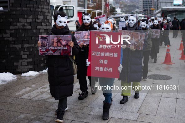 Members of the animal rights group CARE gather near the Chinese Embassy in Myeong-dong to call for the enactment of animal protection laws i...