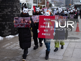 Members of the animal rights group CARE gather near the Chinese Embassy in Myeong-dong to call for the enactment of animal protection laws i...