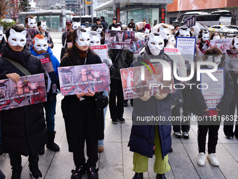 Members of the animal rights group CARE gather near the Chinese Embassy in Myeong-dong to call for the enactment of animal protection laws i...