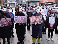 Members of the animal rights group CARE gather near the Chinese Embassy in Myeong-dong to call for the enactment of animal protection laws i...