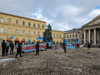 Activists gather at the Residenz in Munich, Germany, on December 10, 2023, to protest the genocide of Uyghurs. Participants hold a prominent...