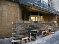 French farmers construct a symbolic wall in front of the French National Institute for Agricultural Research (INRAE) head office to represen...