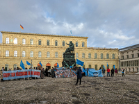 Activists gather at the Residenz in Munich, Germany, on December 10, 2023, to protest the genocide of Uyghurs. Participants hold a prominent...