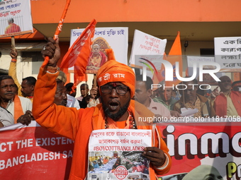 Members of Hindu Jagaran Monch shout slogans during a protest march towards the Bangladesh consulate against the recent arrest of ISKCON Ban...