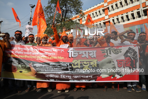 Members of Hindu Jagaran Monch shout slogans during a protest march towards the Bangladesh consulate against the recent arrest of ISKCON Ban...