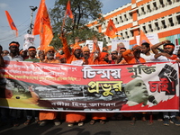 Members of Hindu Jagaran Monch shout slogans during a protest march towards the Bangladesh consulate against the recent arrest of ISKCON Ban...