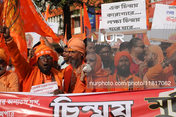 Members of Hindu Jagaran Monch shout slogans during a protest march towards the Bangladesh consulate against the recent arrest of ISKCON Ban...