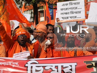 Members of Hindu Jagaran Monch shout slogans during a protest march towards the Bangladesh consulate against the recent arrest of ISKCON Ban...