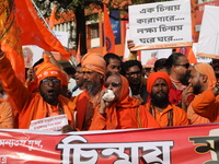 Members of Hindu Jagaran Monch shout slogans during a protest march towards the Bangladesh consulate against the recent arrest of ISKCON Ban...