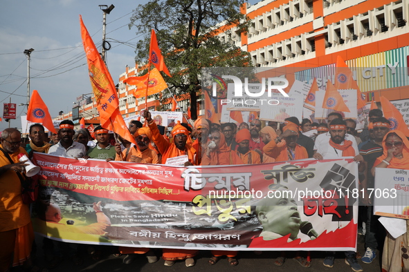 Members of Hindu Jagaran Monch shout slogans during a protest march towards the Bangladesh consulate against the recent arrest of ISKCON Ban...