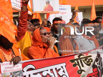 Members of Hindu Jagaran Monch shout slogans during a protest march towards the Bangladesh consulate against the recent arrest of ISKCON Ban...