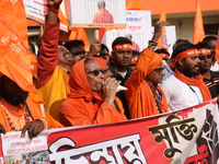 Members of Hindu Jagaran Monch shout slogans during a protest march towards the Bangladesh consulate against the recent arrest of ISKCON Ban...