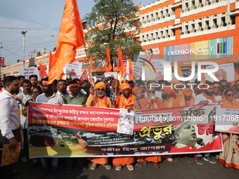 Members of Hindu Jagaran Monch shout slogans during a protest march towards the Bangladesh consulate against the recent arrest of ISKCON Ban...