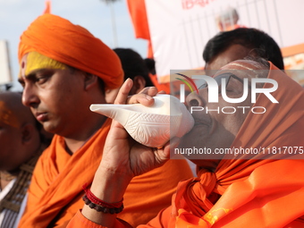 Members of Hindu Jagaran Monch shout slogans during a protest march towards the Bangladesh consulate against the recent arrest of ISKCON Ban...