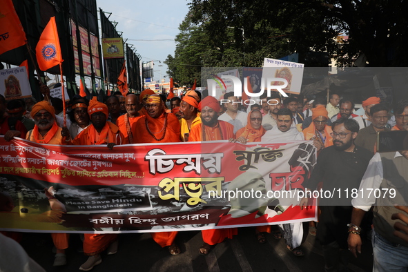 Members of Hindu Jagaran Monch shout slogans during a protest march towards the Bangladesh consulate against the recent arrest of ISKCON Ban...