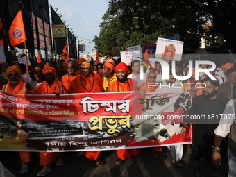 Members of Hindu Jagaran Monch shout slogans during a protest march towards the Bangladesh consulate against the recent arrest of ISKCON Ban...