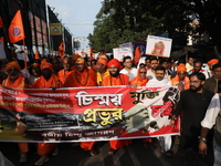 Members of Hindu Jagaran Monch shout slogans during a protest march towards the Bangladesh consulate against the recent arrest of ISKCON Ban...