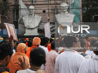 Members of Hindu Jagaran Monch shout slogans during a protest march towards the Bangladesh consulate against the recent arrest of ISKCON Ban...