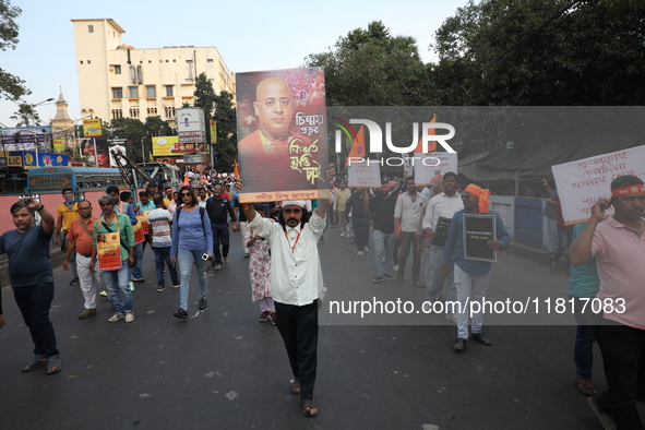 Members of Hindu Jagaran Monch shout slogans during a protest march towards the Bangladesh consulate against the recent arrest of ISKCON Ban...