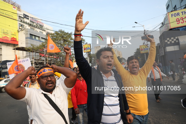 Members of Hindu Jagaran Monch shout slogans during a protest march towards the Bangladesh consulate against the recent arrest of ISKCON Ban...