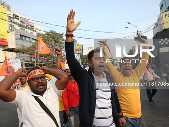 Members of Hindu Jagaran Monch shout slogans during a protest march towards the Bangladesh consulate against the recent arrest of ISKCON Ban...