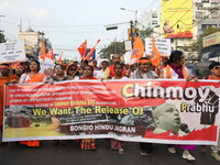 Members of Hindu Jagaran Monch shout slogans during a protest march towards the Bangladesh consulate against the recent arrest of ISKCON Ban...