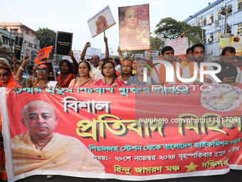 Members of Hindu Jagaran Monch shout slogans during a protest march towards the Bangladesh consulate against the recent arrest of ISKCON Ban...