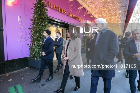 French Delegate Minister of Tourism Economy Marina Ferrari (center), accompanied by Galeries Lafayette department store chairman Philippe Ho...