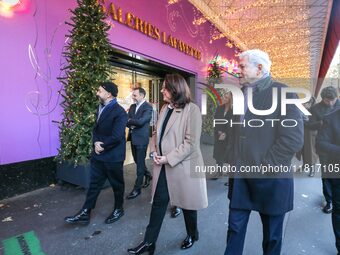 French Delegate Minister of Tourism Economy Marina Ferrari (center), accompanied by Galeries Lafayette department store chairman Philippe Ho...