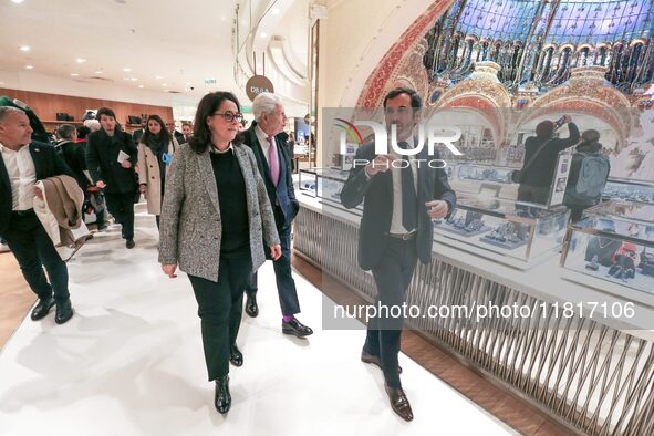 French Delegate Minister of Tourism Economy Marina Ferrari (3R), accompanied by Galeries Lafayette department store chairman Philippe Houze...